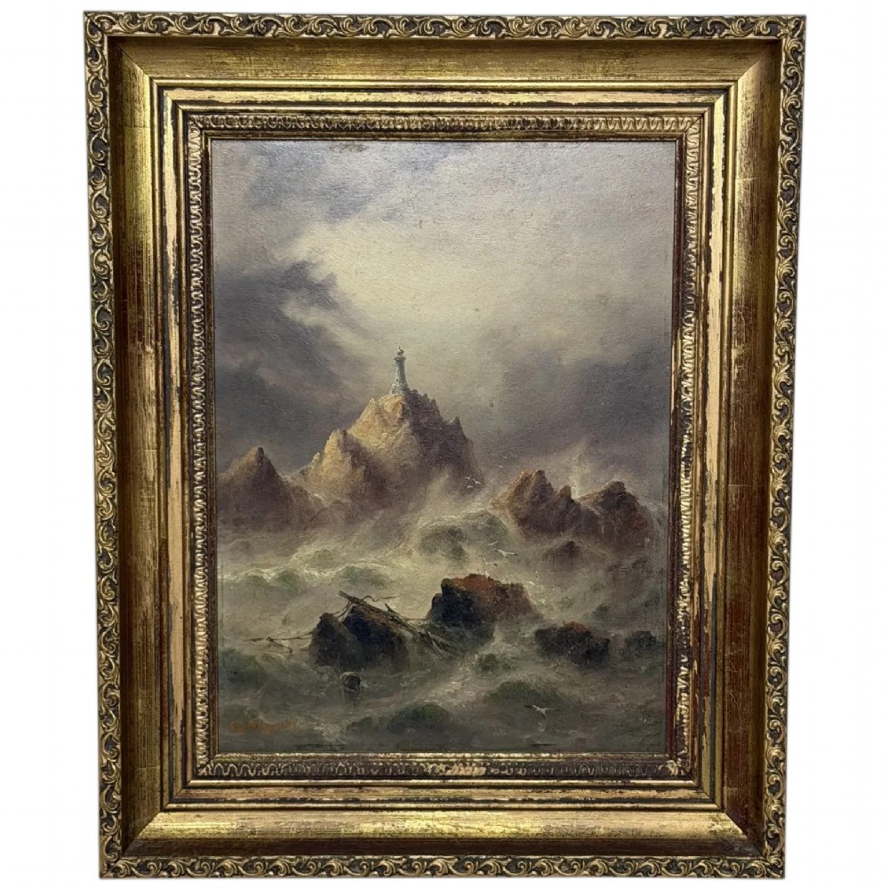 A vertical oil painting framed in carved gold leaf depicting La Corbiere lighthouse atop jagged rocks amidst a stormy grey sea with a shipwreck in the foreground.