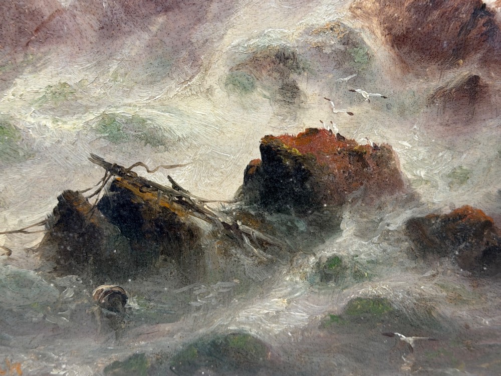 A vertical oil painting framed in carved gold leaf depicting La Corbiere lighthouse atop jagged rocks amidst a stormy grey sea with a shipwreck in the foreground. View VII