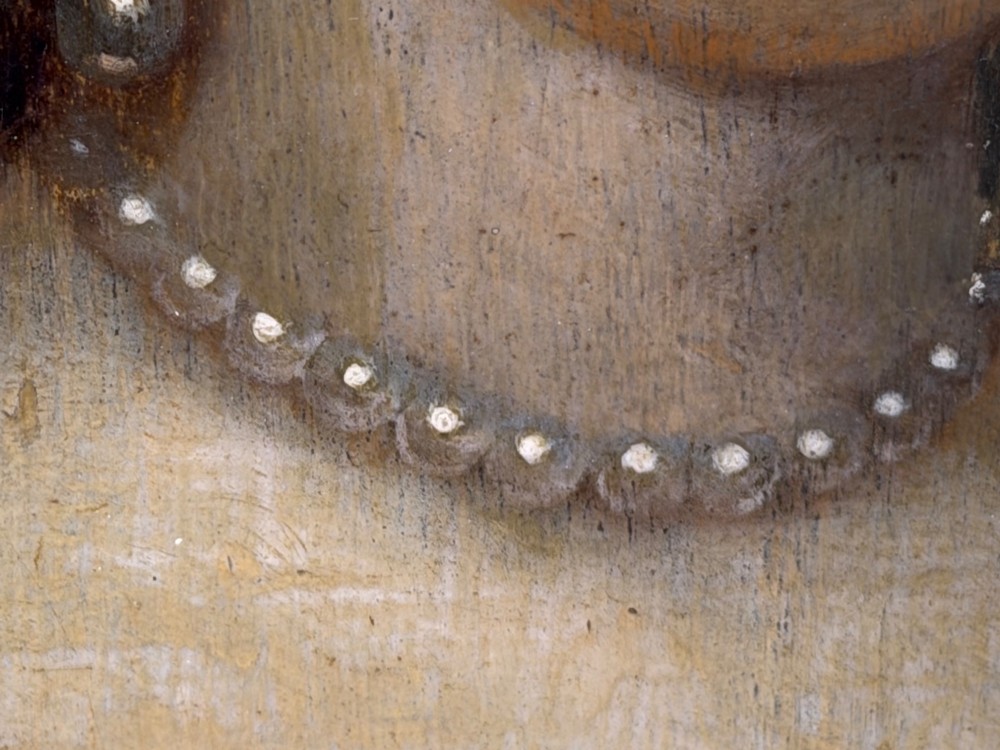 A 17th-century oil portrait painting on an oak panel depicting a woman with dark ringlets and pearl jewellery in a gadrooned gold leaf frame. View XII