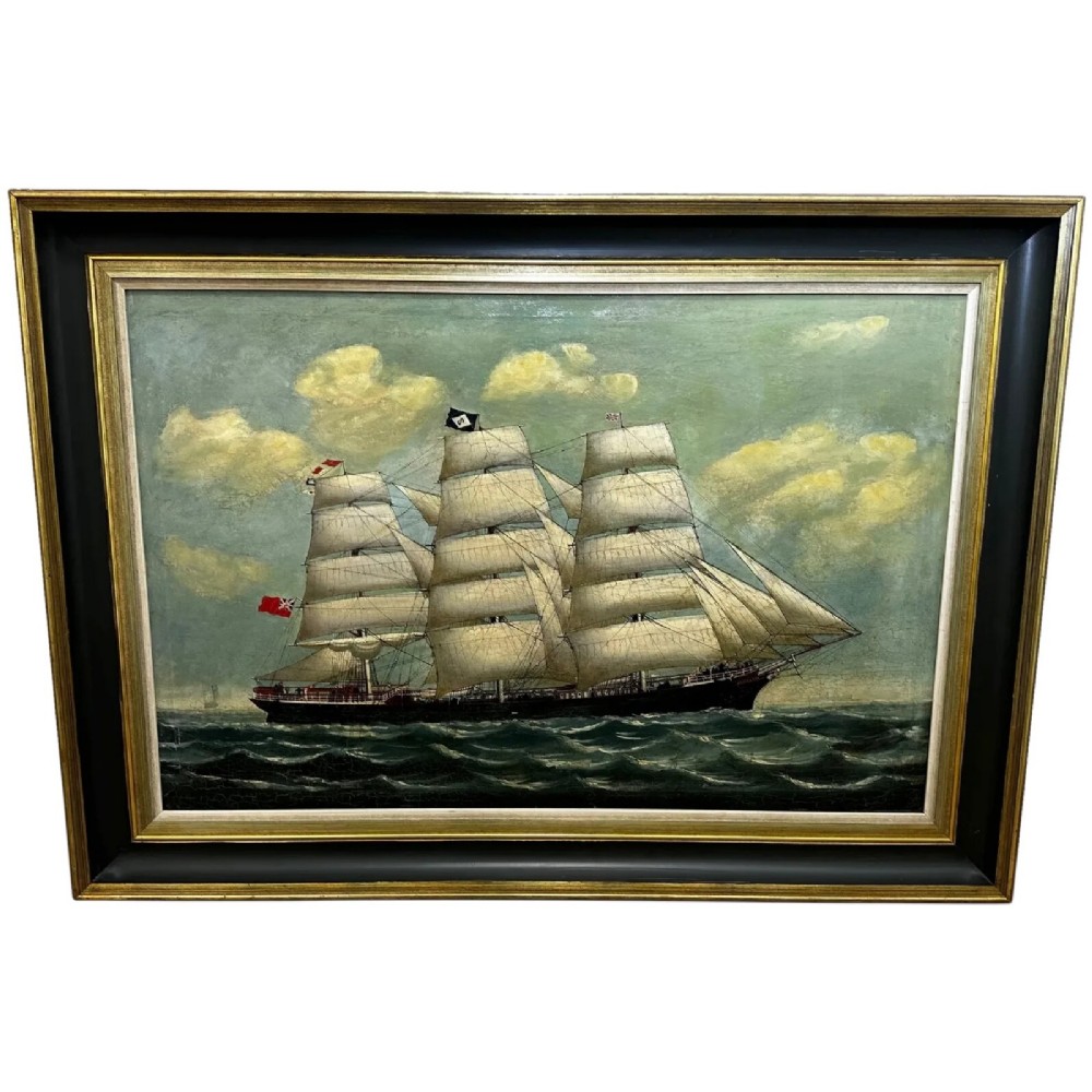 A framed oil painting depicting a full-rigged clipper ship sailing on dark green sea waves under a clouded sky.