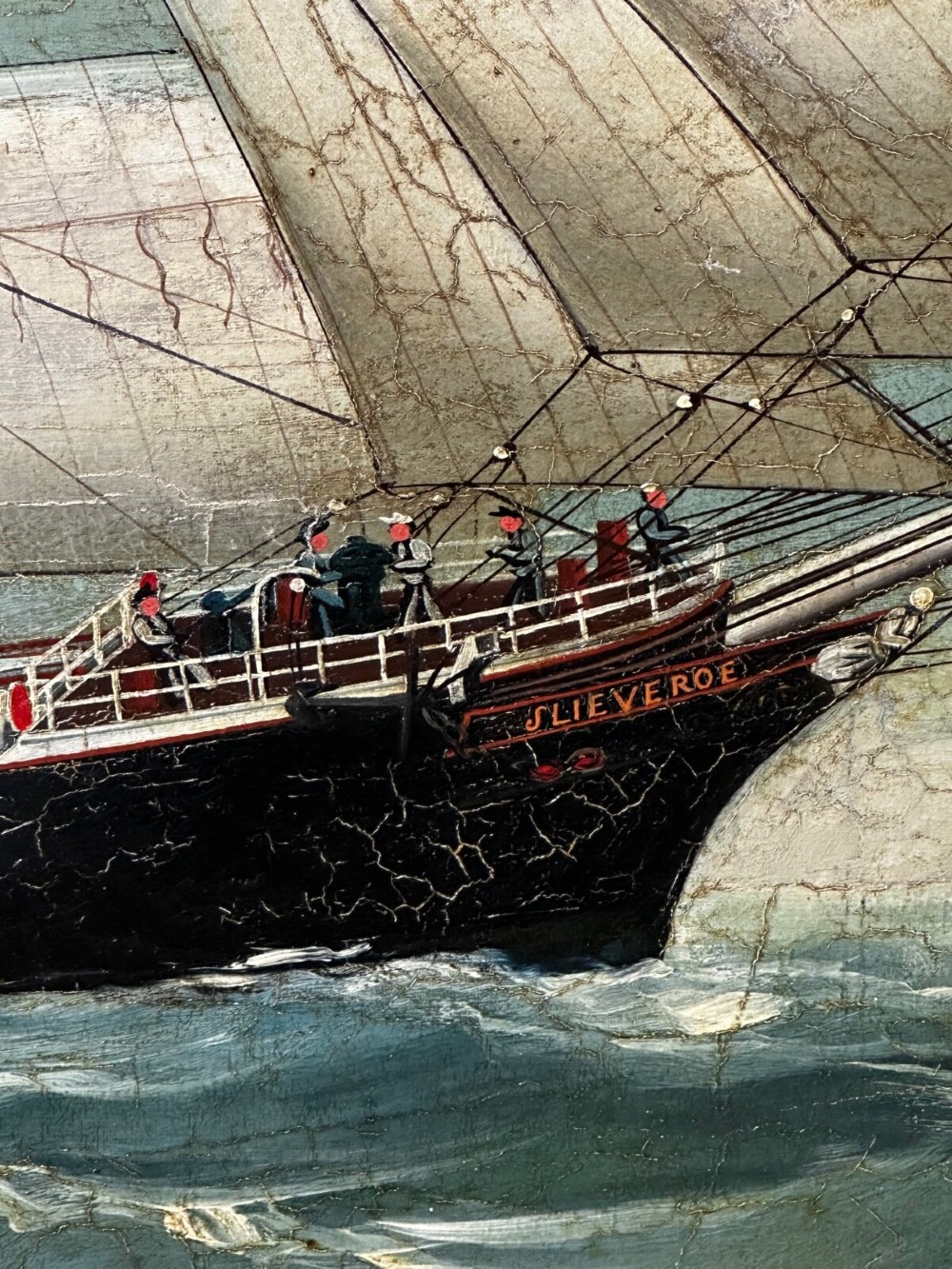 A framed oil painting depicting a full-rigged clipper ship sailing on dark green sea waves under a clouded sky. View III