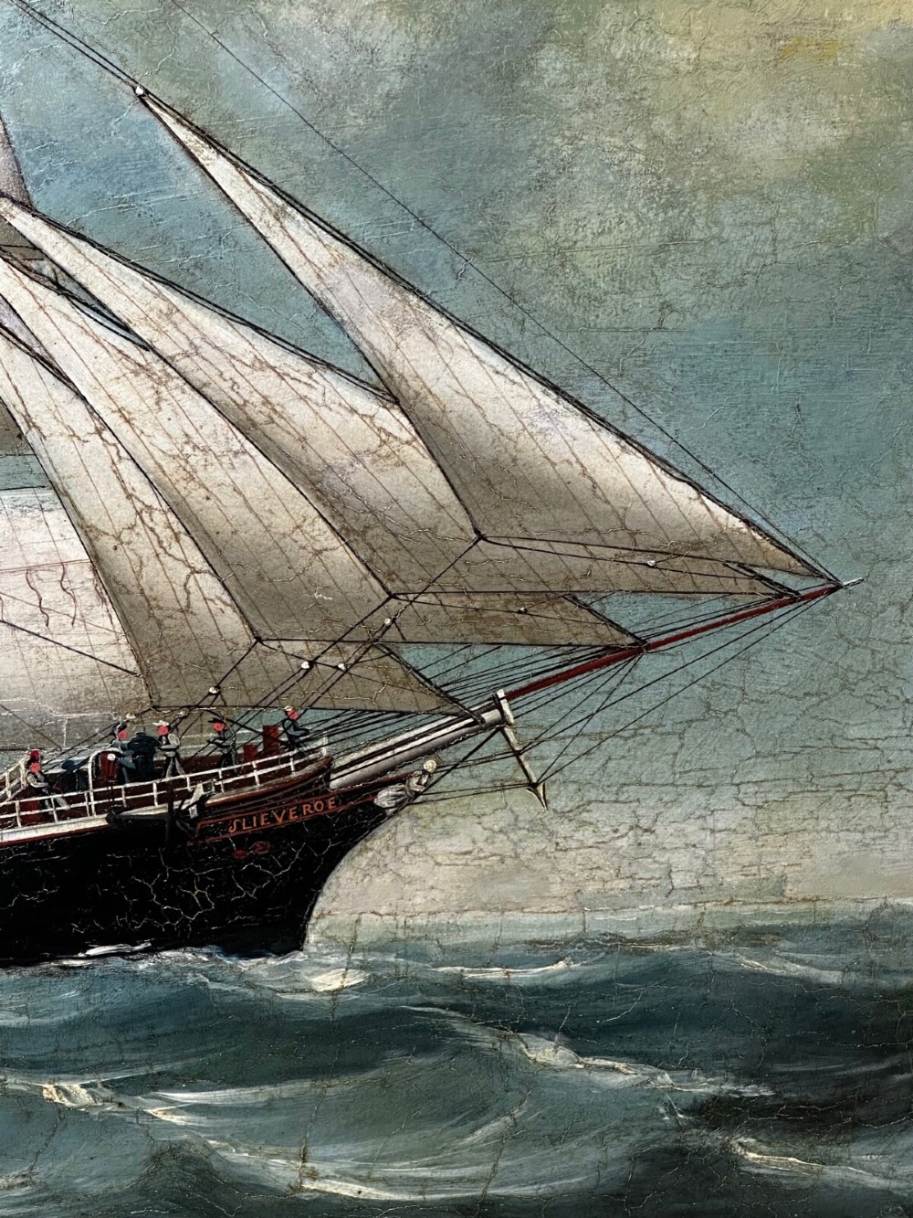 A framed oil painting depicting a full-rigged clipper ship sailing on dark green sea waves under a clouded sky. View VII