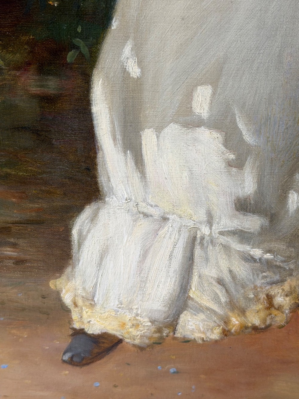 An antique oil painting depicting a seated woman in a white dress holding a red parasol, presented in an ornate carved gilded frame. View VIII