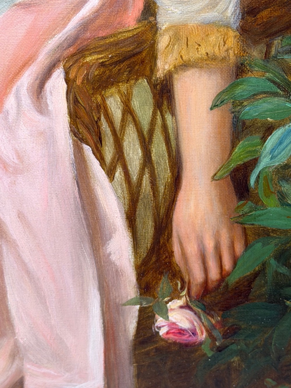 An antique oil painting depicting a seated woman in a white dress holding a red parasol, presented in an ornate carved gilded frame. View IX