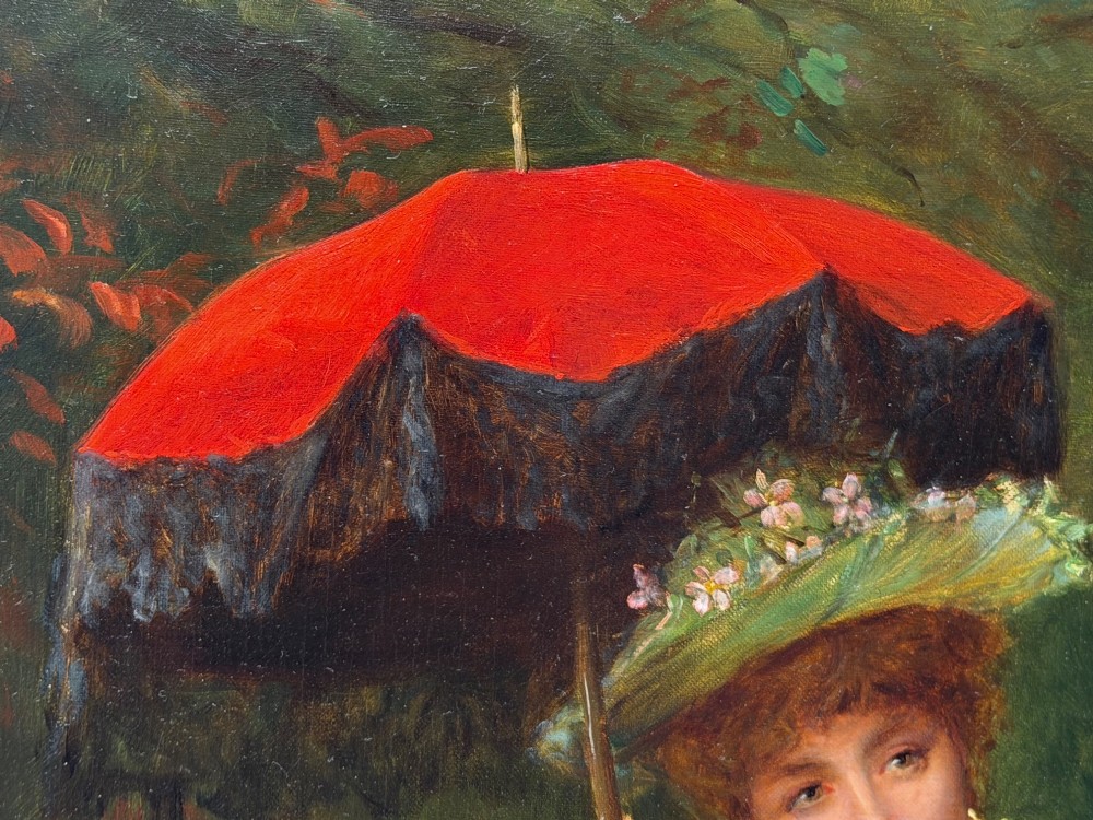 An antique oil painting depicting a seated woman in a white dress holding a red parasol, presented in an ornate carved gilded frame. View XI