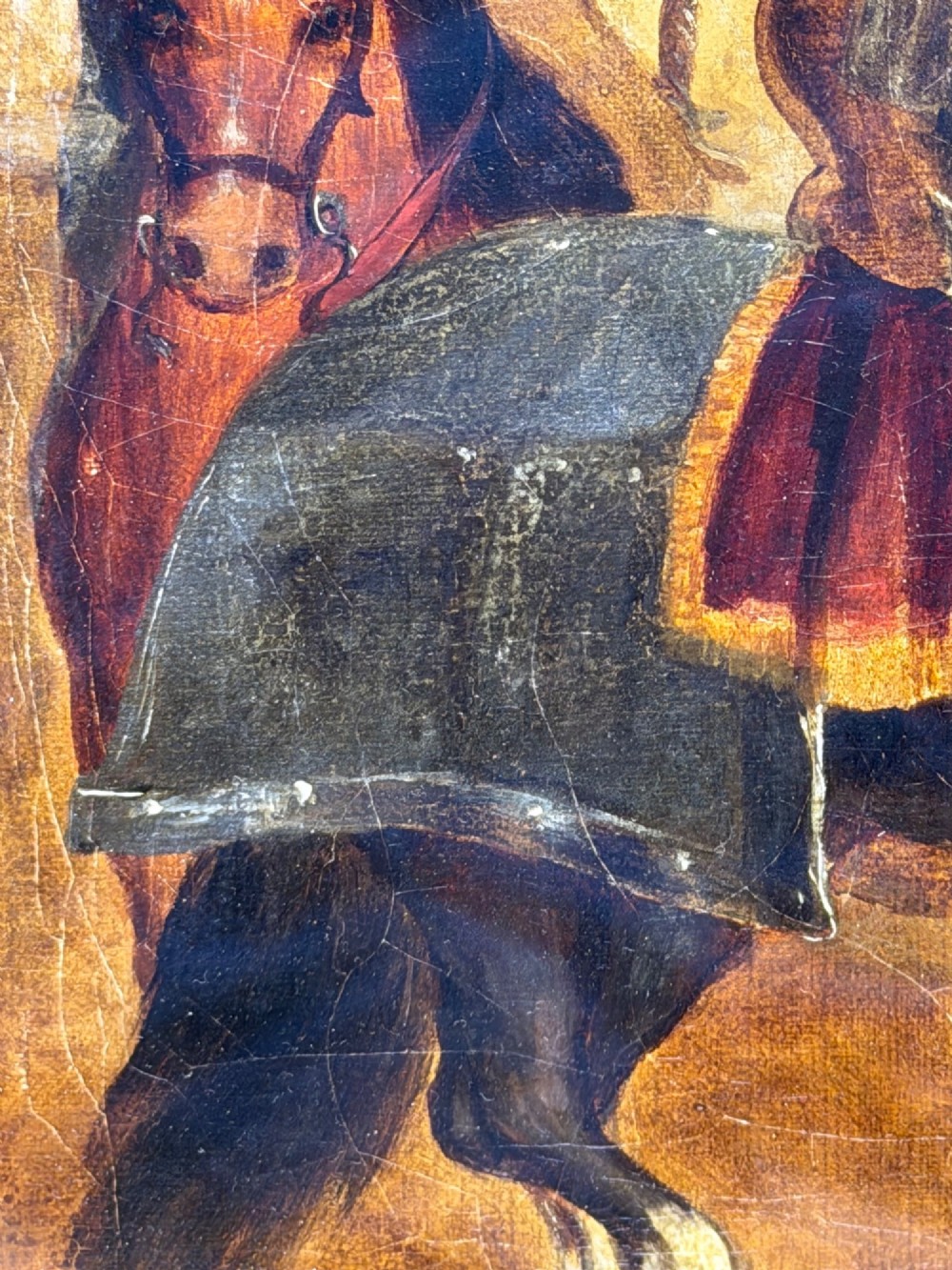 An antique oil painting depicting a knight in full armour riding a horse beneath a stone archway, framed in an ornate gilded wood frame. View XII