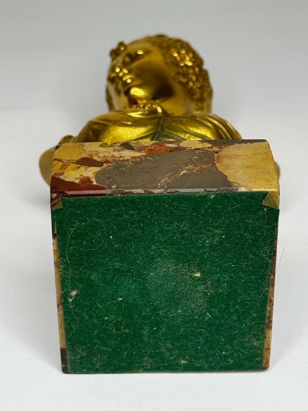 A 19th-century gilt bronze bust portrait of Diana de Poitiers featuring an ornate hairstyle and classical drapery, mounted on a dark socle and square variegated marble base. View XII