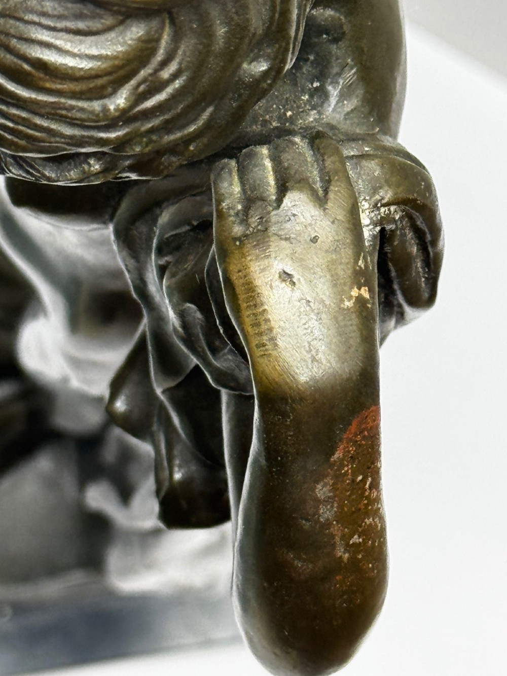 A dark brown patinated French bronze sculpture depicting a standing female nude draped in flowing fabric, mounted on a dark marble base. View VIII