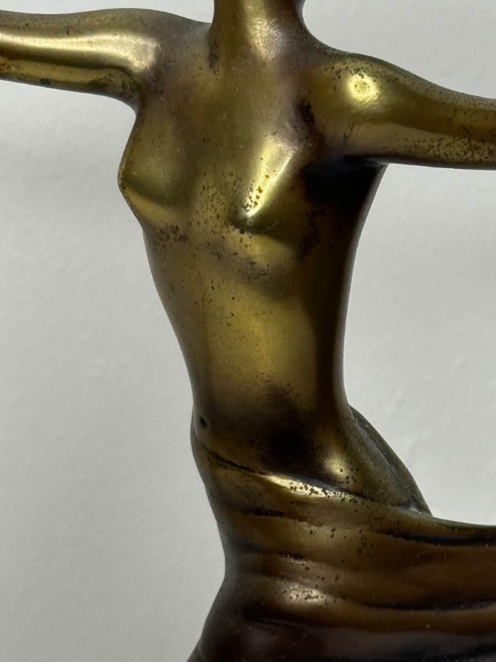 An Art Deco bronze sculpture depicting a dancer with draped fabric, mounted on a green onyx pedestal base. View V
