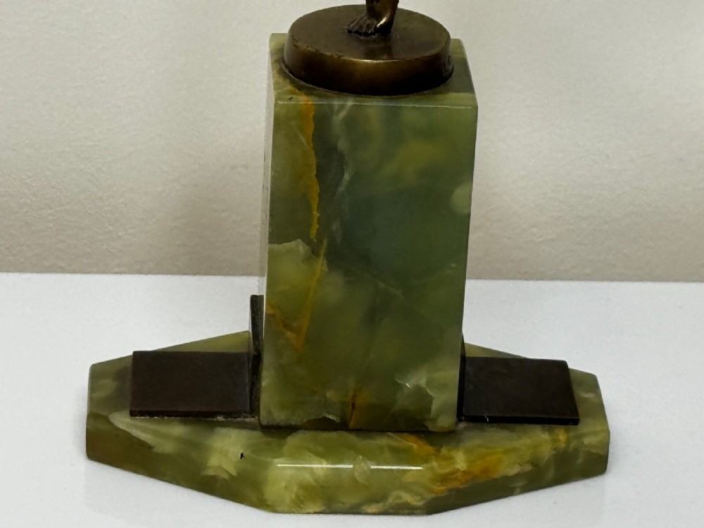 An Art Deco bronze sculpture depicting a dancer with draped fabric, mounted on a green onyx pedestal base. View VI