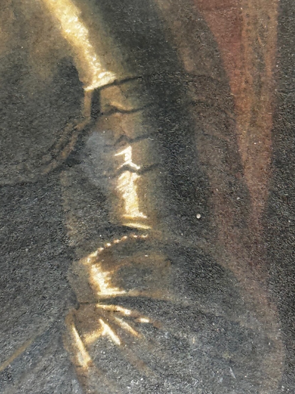 An antique profile portrait painting of a man wearing full steel armour, set within an ornate gilded frame decorated with carved shell and scroll motifs. View II