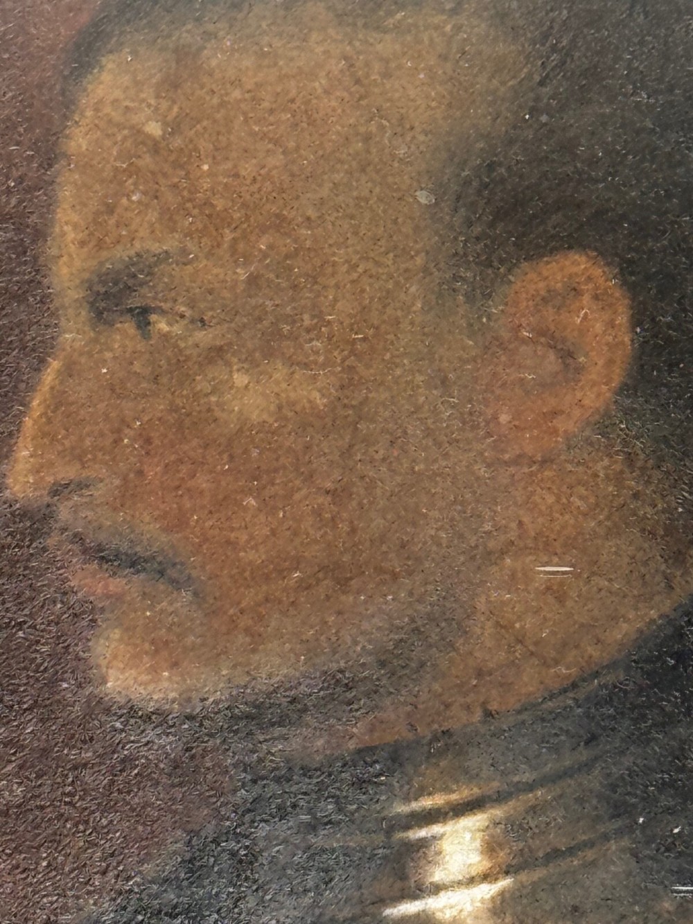 An antique profile portrait painting of a man wearing full steel armour, set within an ornate gilded frame decorated with carved shell and scroll motifs. View X