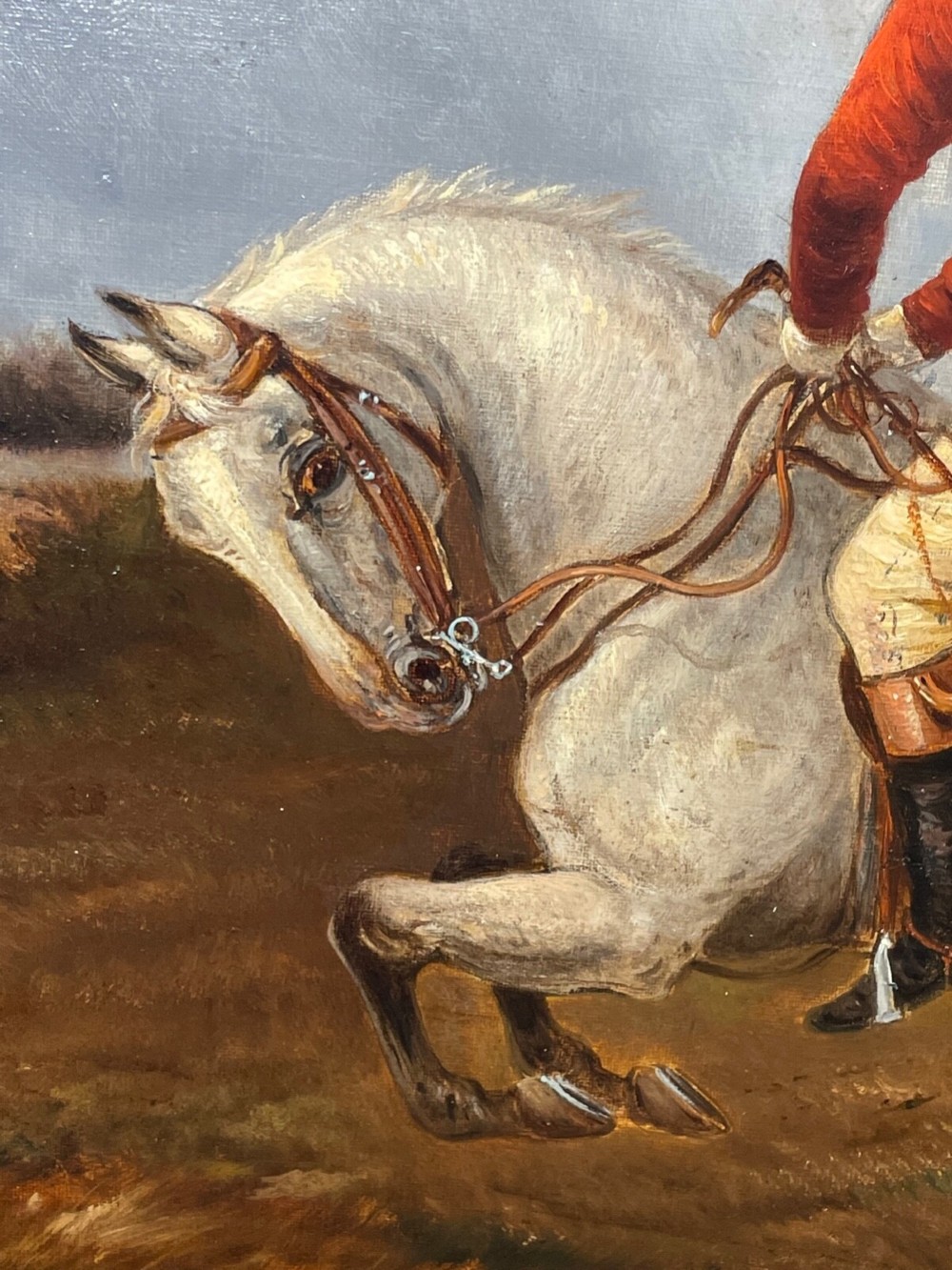 An antique Victorian oil painting depicting horse riders in red hunting coats on grey and bay horses, housed within an ornate gilt frame. View II