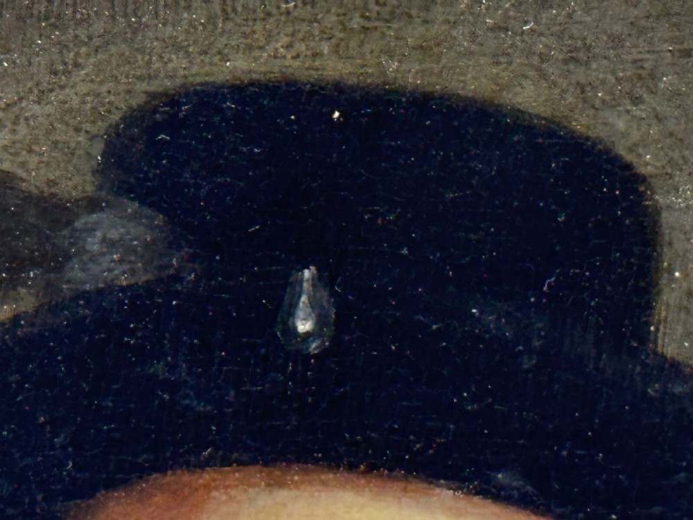 An 18th-century oil portrait of a man in a black hat, ruff collar, and crimson doublet set inside a carved gold-gilded frame. View VI