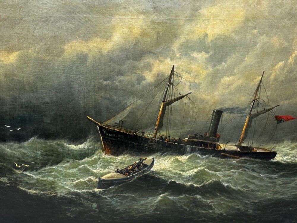 A late Victorian oil painting framed in gold depicting a steamship navigating turbulent dark green seas alongside a small rescue boat. View II