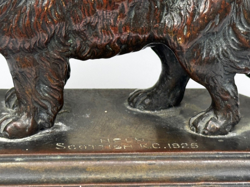 A patinated dark bronze sculpture depicting a standing Newfoundland dog positioned on a bevelled rectangular base. View II