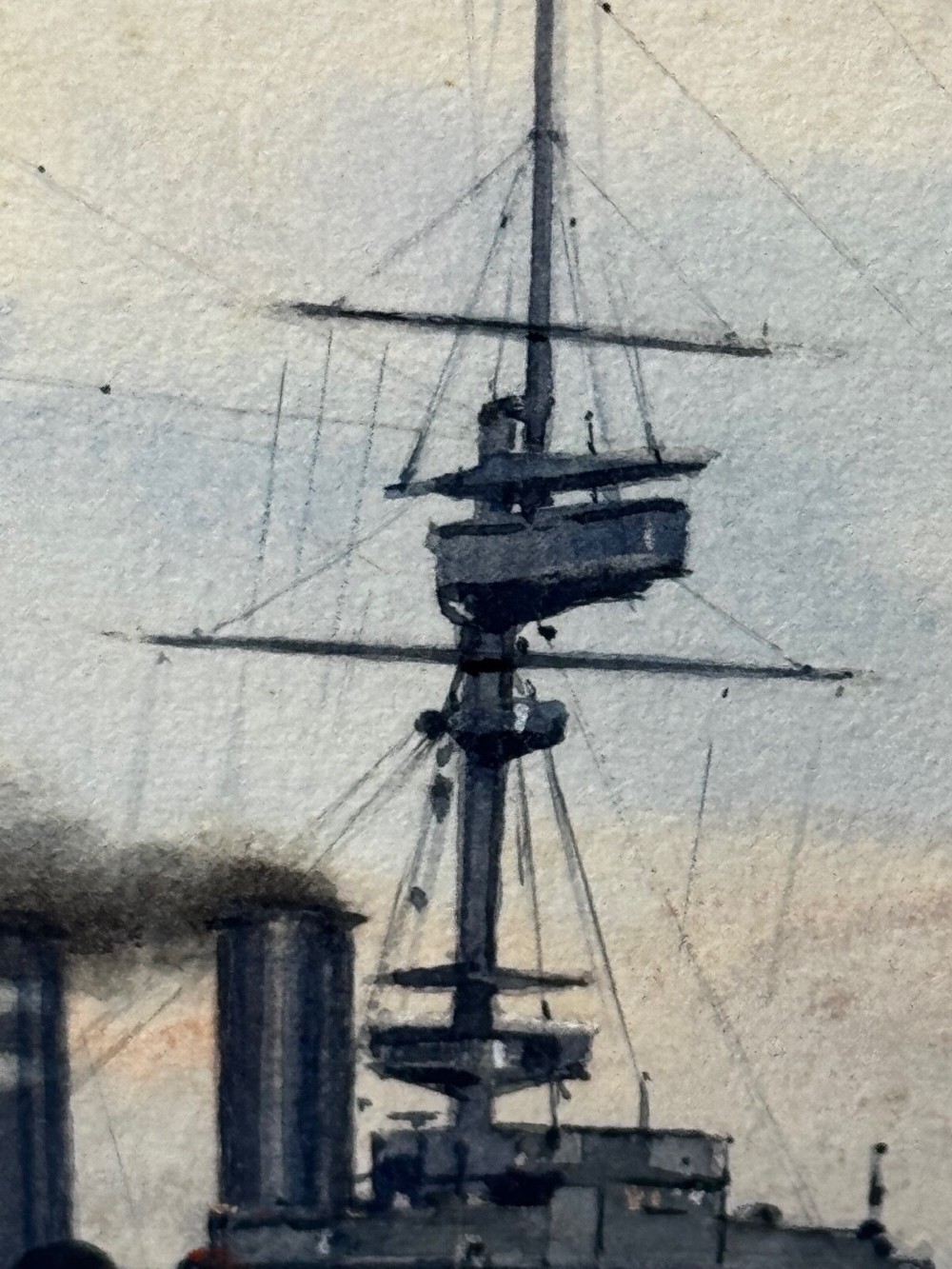 A framed watercolour painting depicting the WW1 battleship HMS London at sea, presented in a wide gold gilt frame with a white mount. View XII