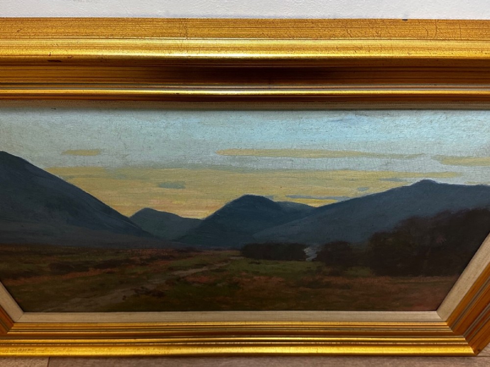 An oil painting on canvas depicting a Scottish mountain landscape under a pale yellow sky, framed in a moulded gold frame with a linen inner slip. View VIII
