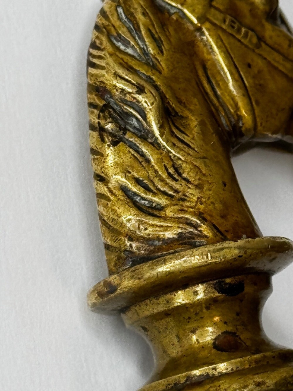 A cast brass Georgian desk seal sculpted in the shape of a detailed horse head above a rounded pedestal with an engraved intaglio base. View VII