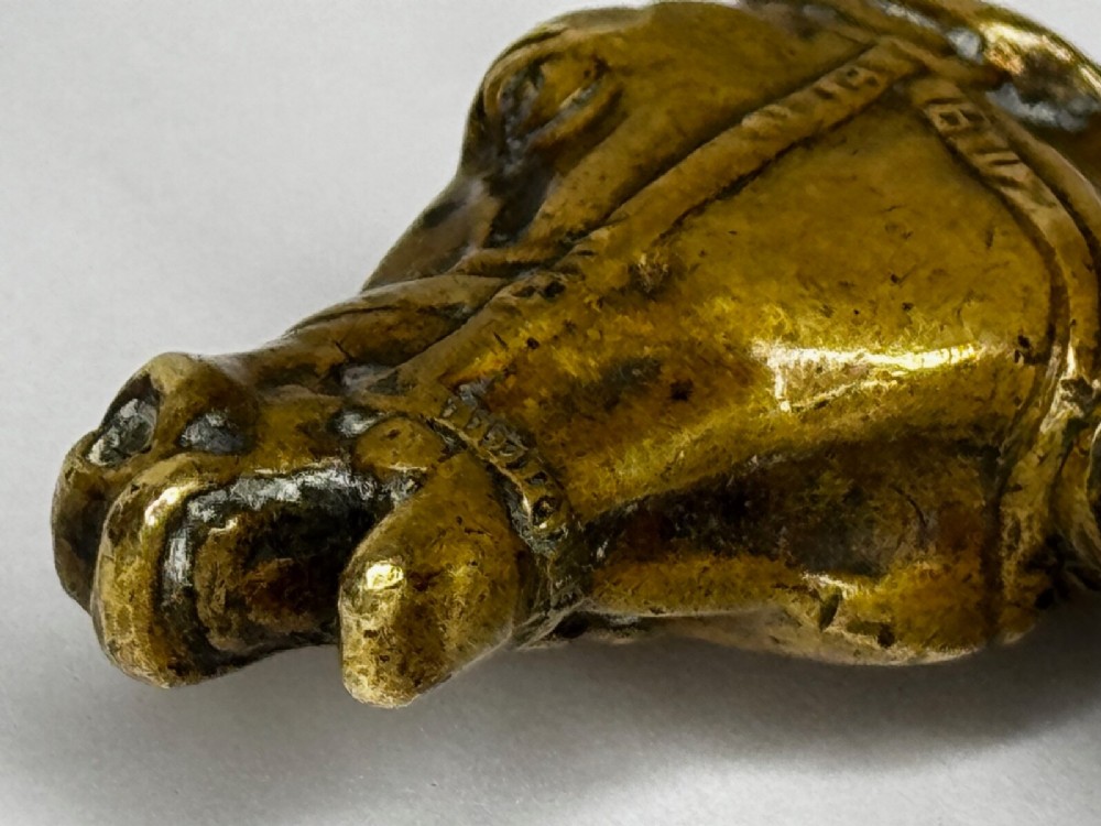 A cast brass Georgian desk seal sculpted in the shape of a detailed horse head above a rounded pedestal with an engraved intaglio base. View VIII