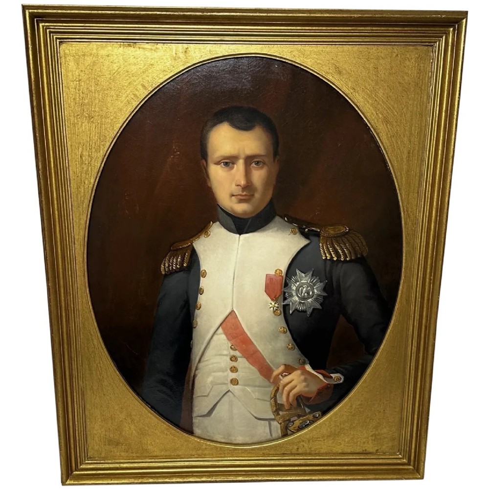 A 19th-century oil painting depicting Napoleon I in a military uniform within an oval spandrel and a rectangular gilded frame.