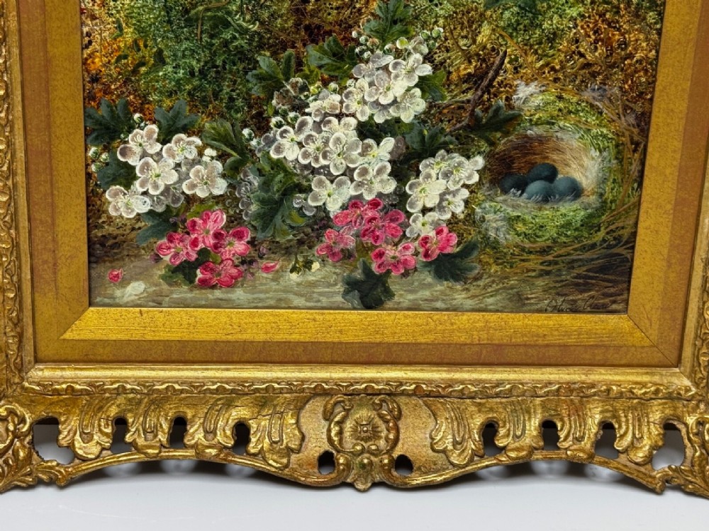 A Victorian oil painting depicting white and pink blossoms alongside a bird nest with three blue eggs, framed in an ornate pierced gold leaf frame. View XIII