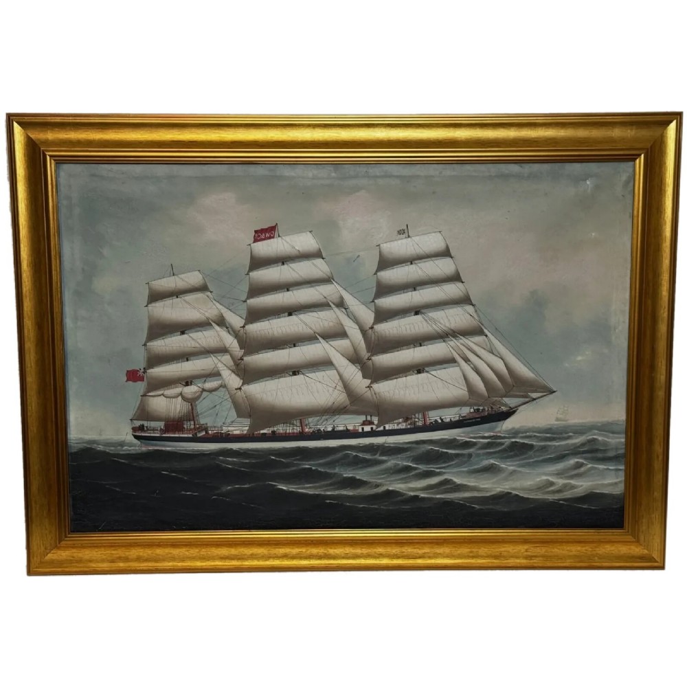 A framed oil painting depicting a three-masted sailing ship navigating dark blue seas under a cloudy sky within a gold gilt frame.