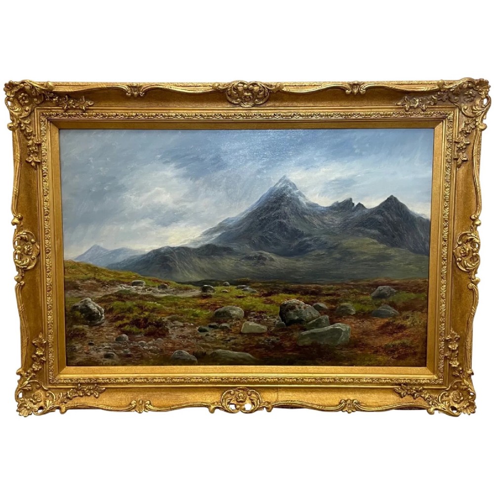 A Victorian oil painting depicting the mountain peak of Sgurr nan Gillean in Skye, housed in a wide ornate gold gilt frame.