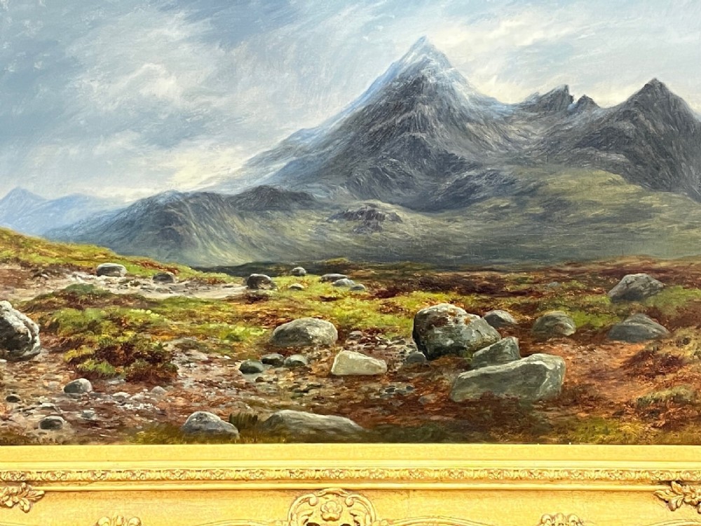 A Victorian oil painting depicting the mountain peak of Sgurr nan Gillean in Skye, housed in a wide ornate gold gilt frame. View VI