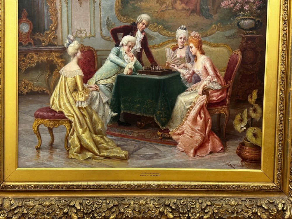 An 19th-century framed oil painting depicting figures in period attire gathered around a table engaged in a game of chess. View V