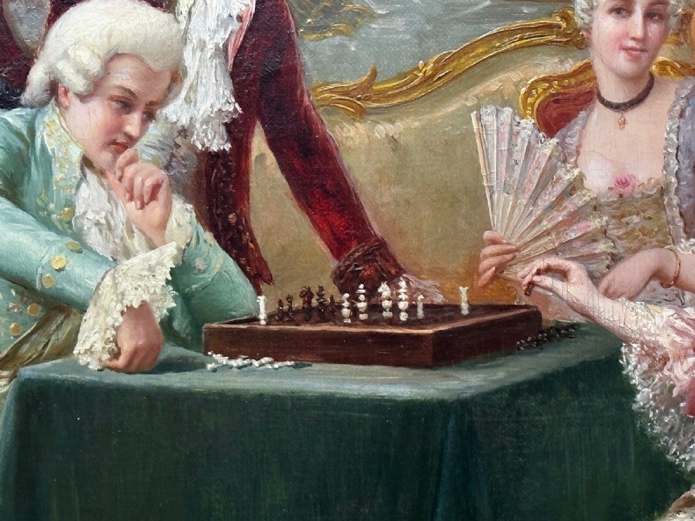 An 19th-century framed oil painting depicting figures in period attire gathered around a table engaged in a game of chess. View VII