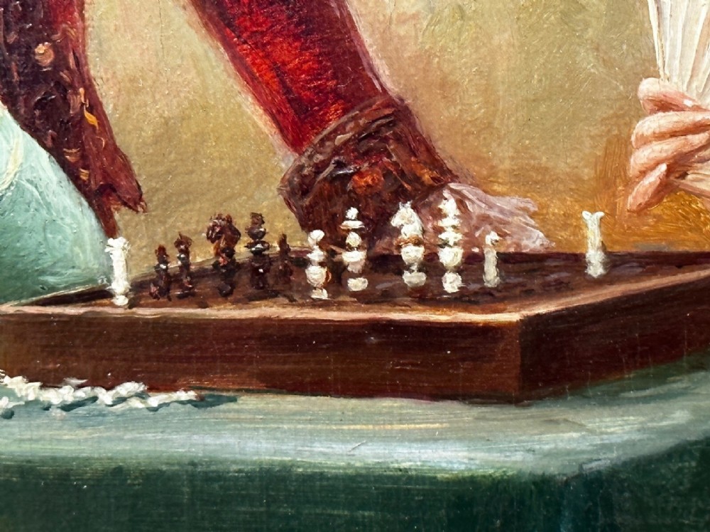 An 19th-century framed oil painting depicting figures in period attire gathered around a table engaged in a game of chess. View XIV