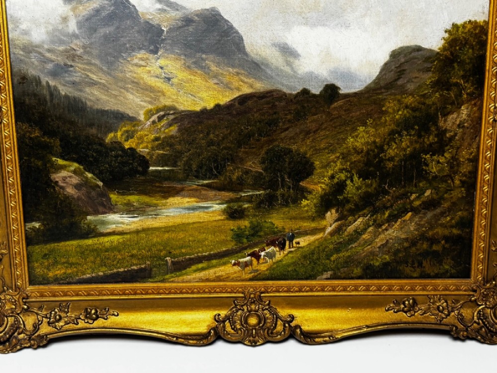 A Victorian landscape oil painting depicting a Cumbrian valley with mountains and cattle, set within an ornate gilded frame. View VII