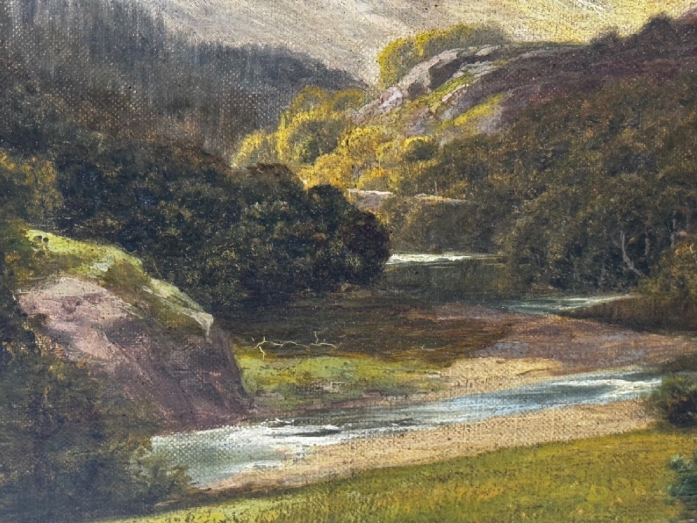 A Victorian landscape oil painting depicting a Cumbrian valley with mountains and cattle, set within an ornate gilded frame. View XII