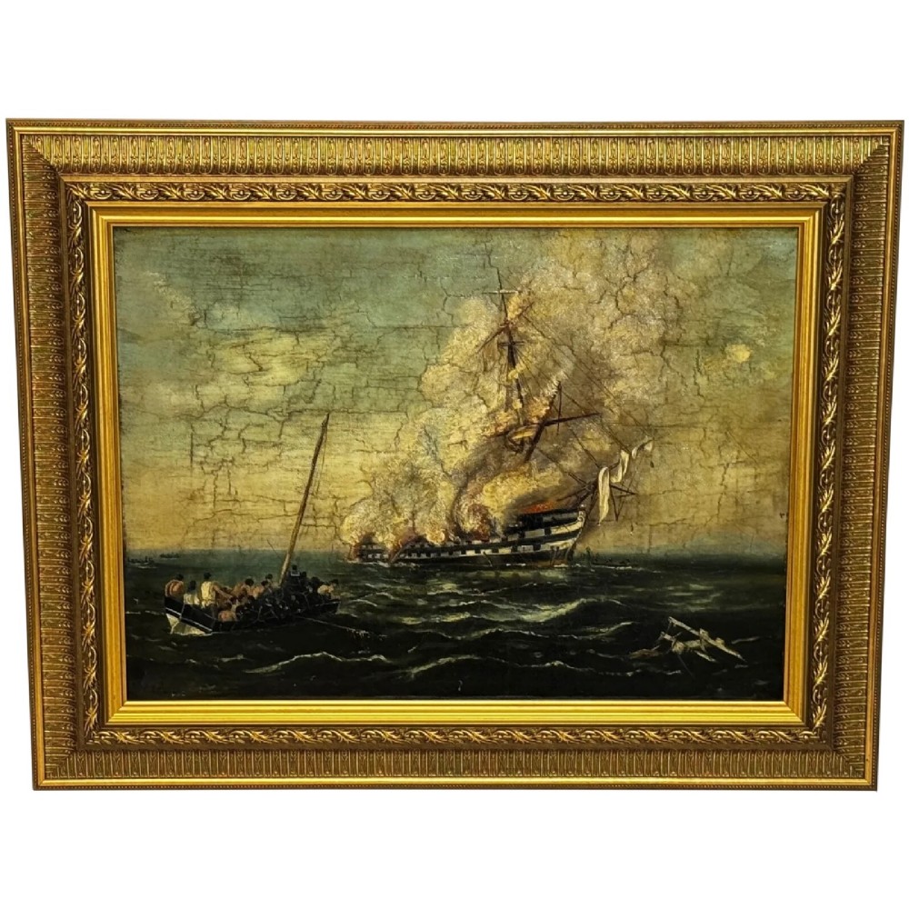 An antique oil painting depicting a burning nineteenth-century ship on a dark sea, enclosed in a heavily moulded gold gilt frame.