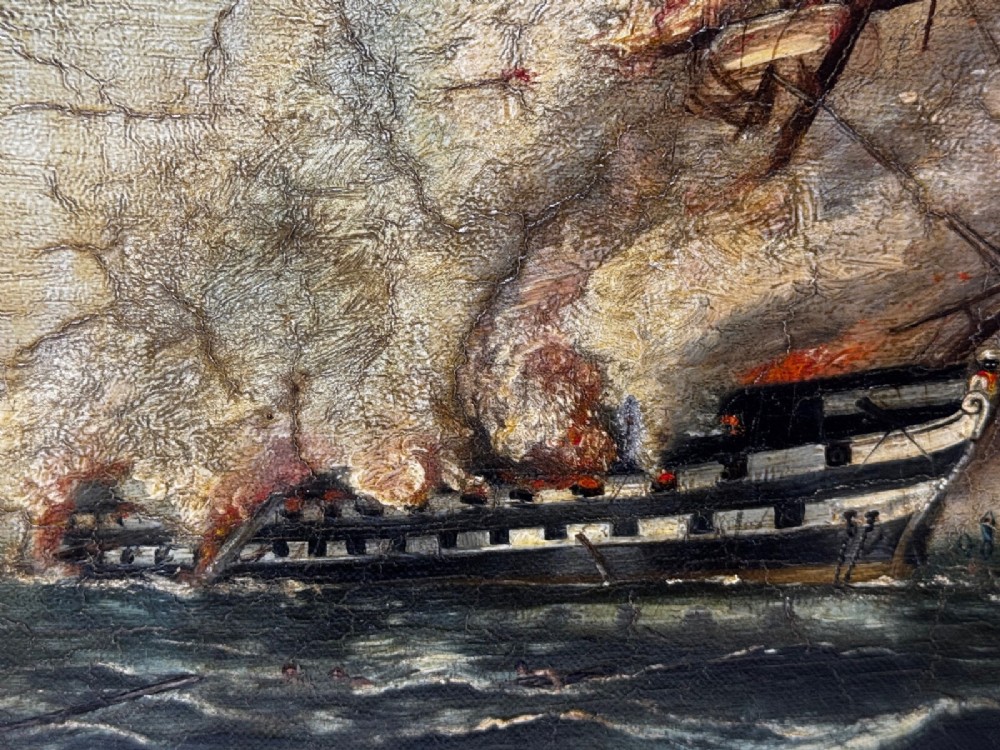 An antique oil painting depicting a burning nineteenth-century ship on a dark sea, enclosed in a heavily moulded gold gilt frame. View V