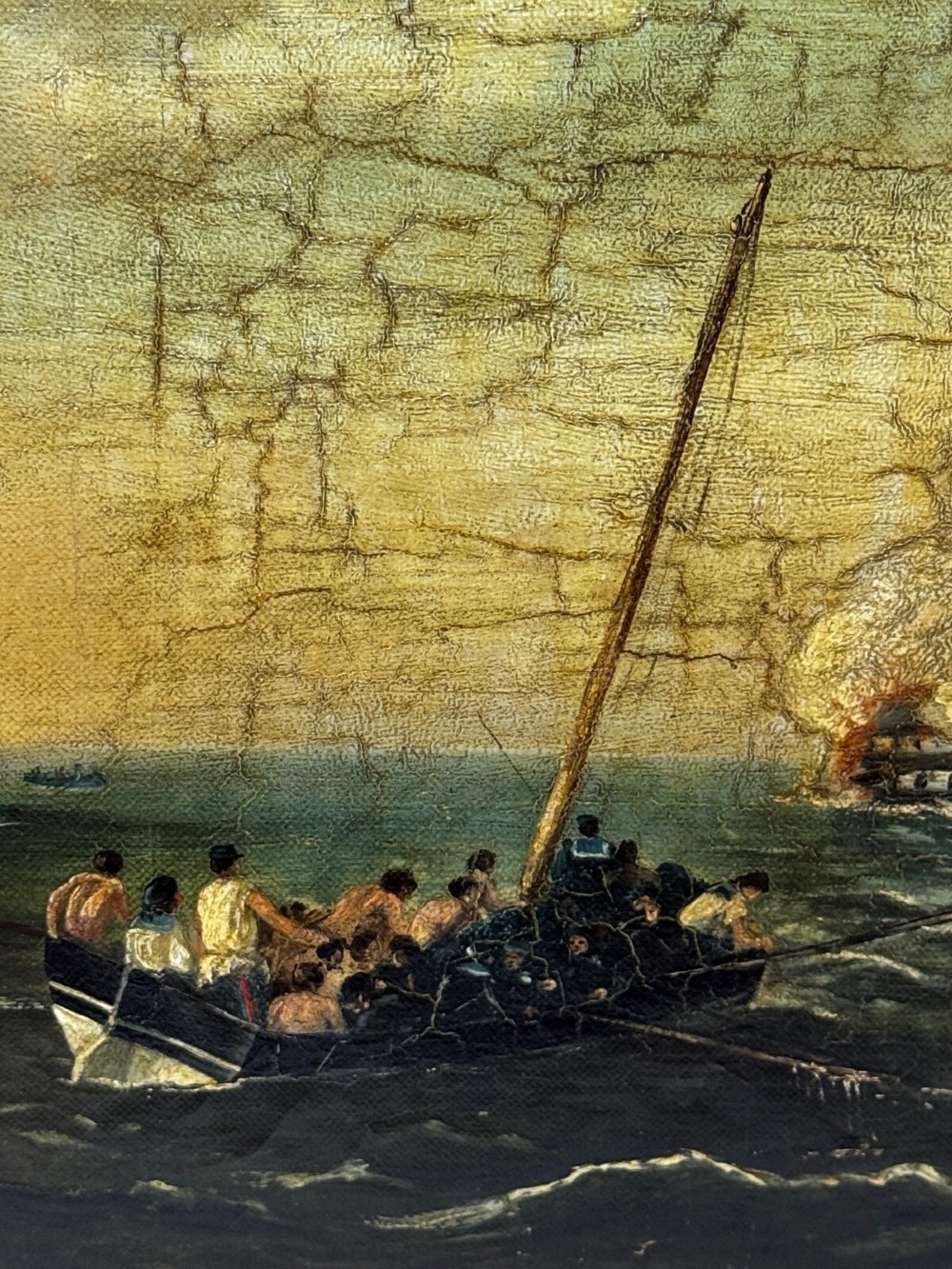 An antique oil painting depicting a burning nineteenth-century ship on a dark sea, enclosed in a heavily moulded gold gilt frame. View XI