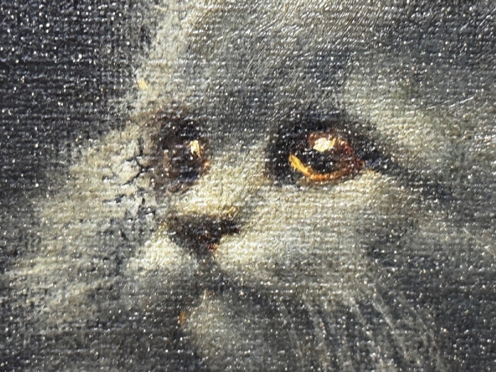An antique framed oil painting depicting five grey and cream Persian kittens positioned around a wicker basket and a floral porcelain teapot. View II