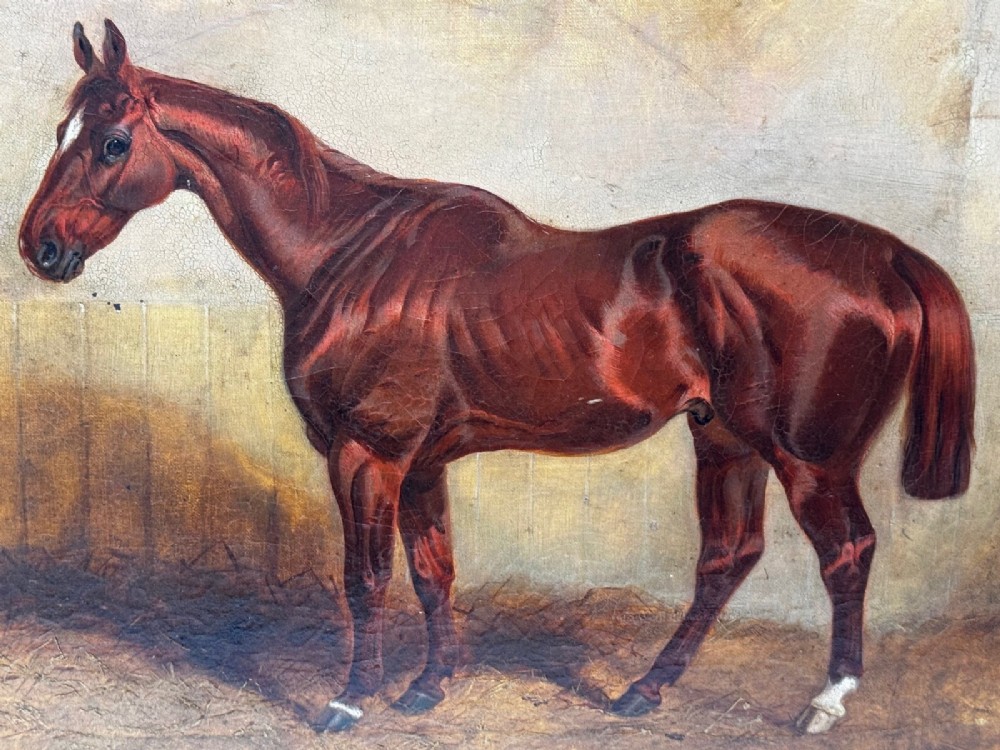 An 1843 oil painting depicting a chestnut hunter horse standing in a stable, encased in an ornate gilded carved frame. View VII