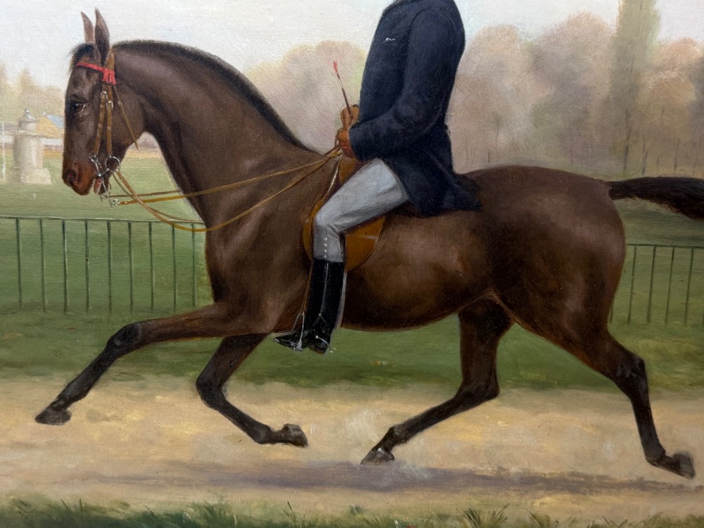 A Victorian oil painting depicting a gentleman in formal riding attire atop a brown horse, framed within a wide gold gilded frame. View XII
