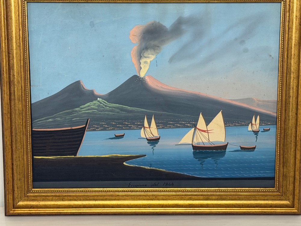 A framed 19th-century gouache painting depicting the eruption of Mount Vesuvius over the Bay of Naples with sailboats in the foreground. View IV