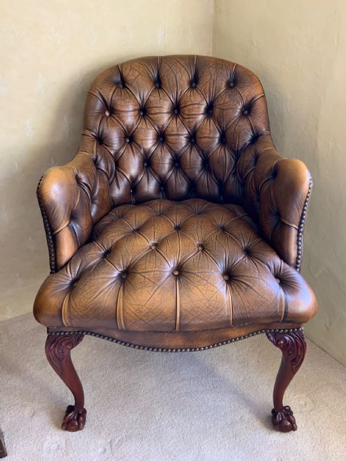 a leather upholstered arm chair - CATEGORY: ANTIQUE CHAIRS - DATED 1930