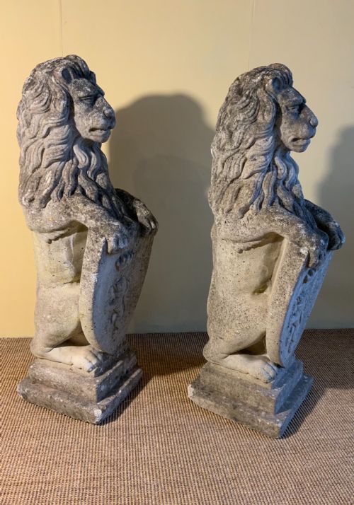 PAIR OF COMPOSITION STONE LIONS - ADDITIONAL PHOTO 1