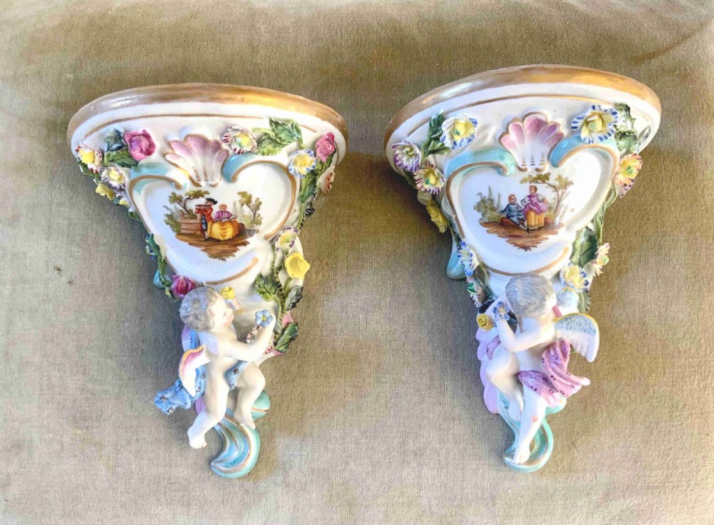 A pair of late 19 th century porcelain wall brackets