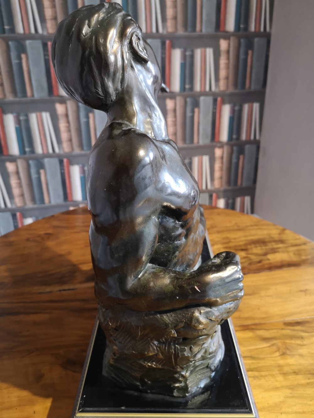 Patinated bronze sculpture of a reclining male nude View III