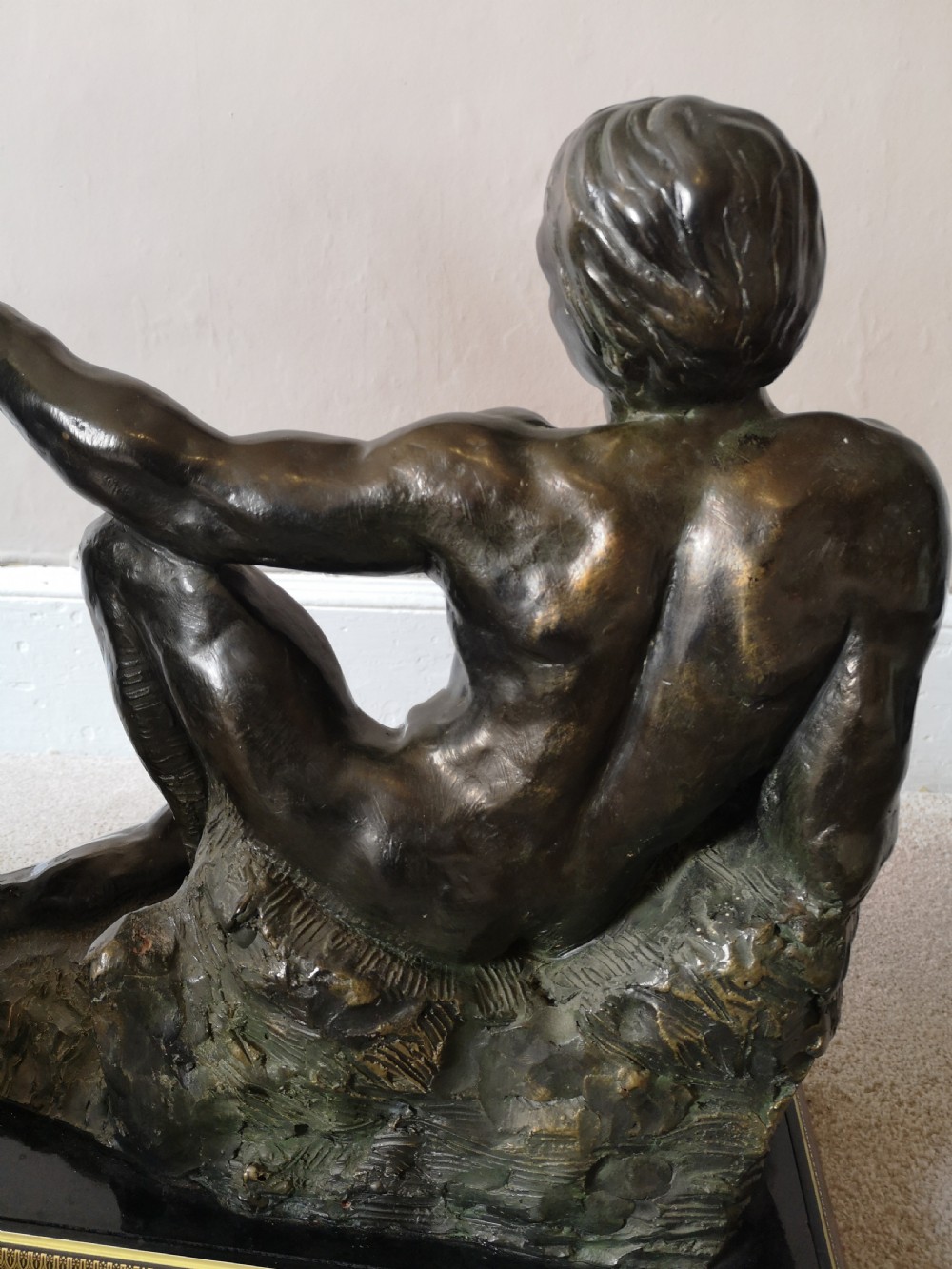 Patinated bronze sculpture of a reclining male nude View IV