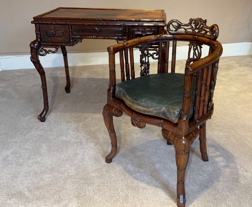 A 19th century Chinese desk and matching chair