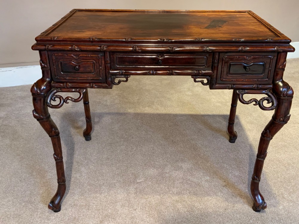 A 19th century Chinese desk and matching chair View II