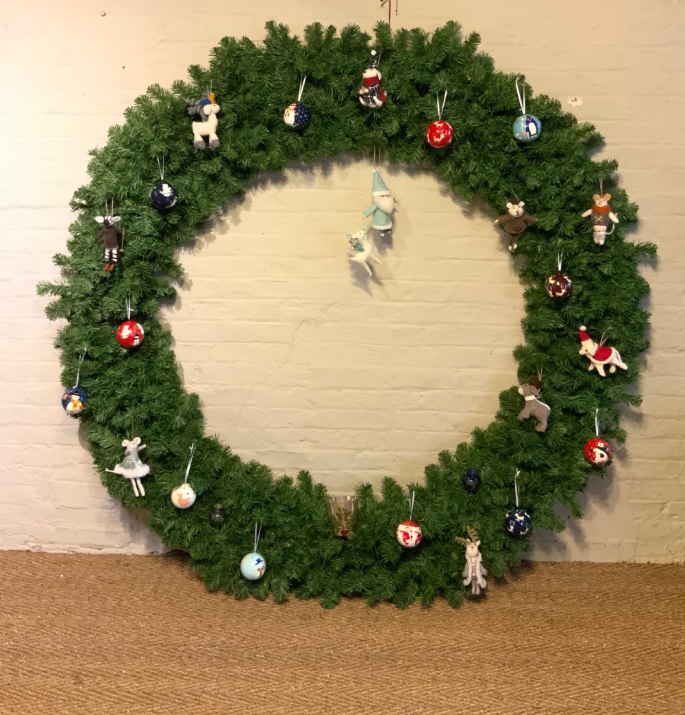 A very large pair of window dressing wreaths View V