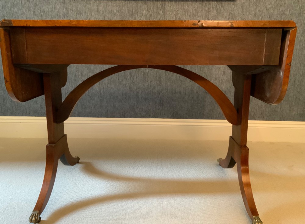 A 19th century walnut sofa table View X